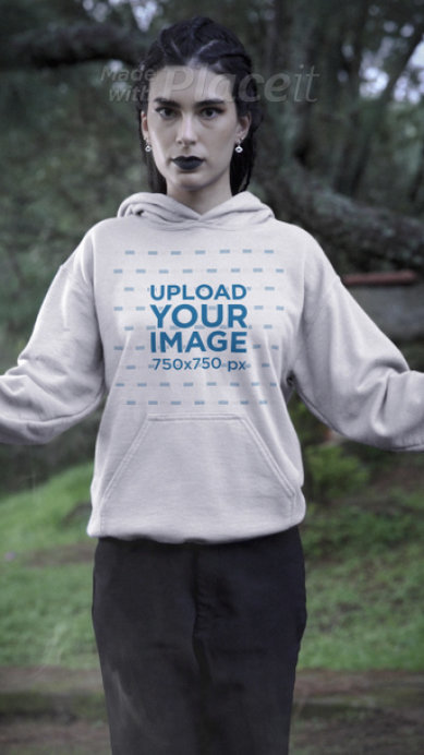 Video of a Serious Woman Wearing Hoodie Featuring a Wicca Theme