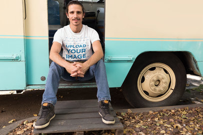 Man Sitting on his Foodtruck Door Wearing a T-Shirt Mockup