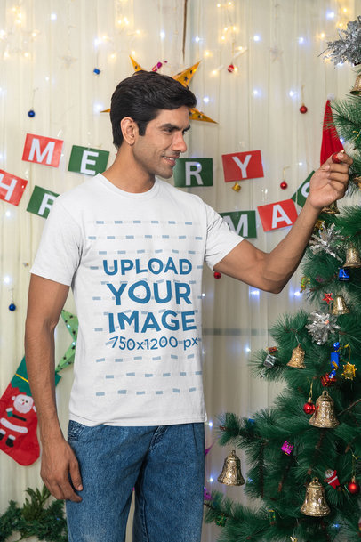 Gildan Tee Mockup of a Happy Man Decorating a Christmas Tree m30621
