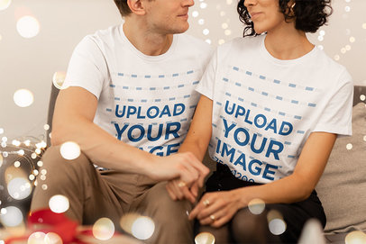 Round-Neck T-Shirt Mockup of a Couple Surrounded by Christmas Lights