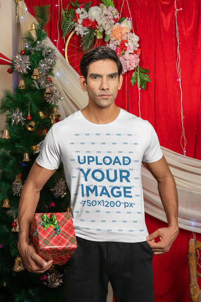 Gildan T-Shirt Mockup Featuring a Serious Man Celebrating Christmas