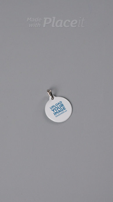 Video of a Dog Tag Placed Over a Grey Background