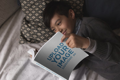 Happy Kid Reading a Book Mockup While in Bed