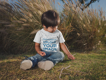 Little Kid Wearing a T-Shirt Mockup at a Park