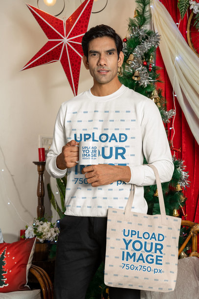 Sweatshirt Mockup of a Man Holding an 11 oz Coffee Mug and a Tote Bag Featuring a Xmas Theme