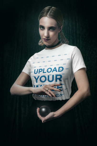 Wicca-Themed Mockup of a Woman Wearing a Bella Canvas Tee and Holding a Crystal Ball