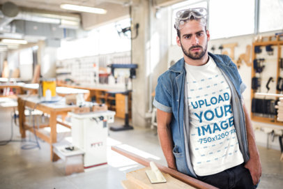 Bearded Carpenter Wearing a T-Shirt Mockup at the Shop a20161