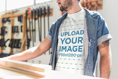 Cropped Face Carpenter Wearing a T-Shirt Mockup While at his Workshop a20163