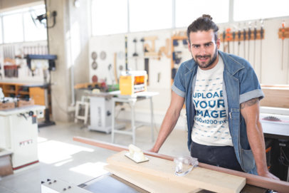 Long Haired Bearded Carpenter Wearing a T-Shirt Mockup at the Shop a20164