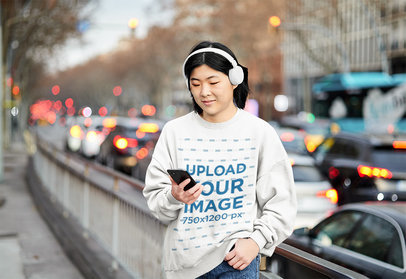 Sweatshirt Mockup Featuring a Woman Checking a Smartphone m30592 r-el2
