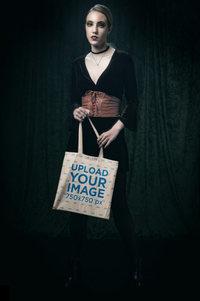 Tote Bag Mockup of a Woman Posing in a Wicca-Themed Setting