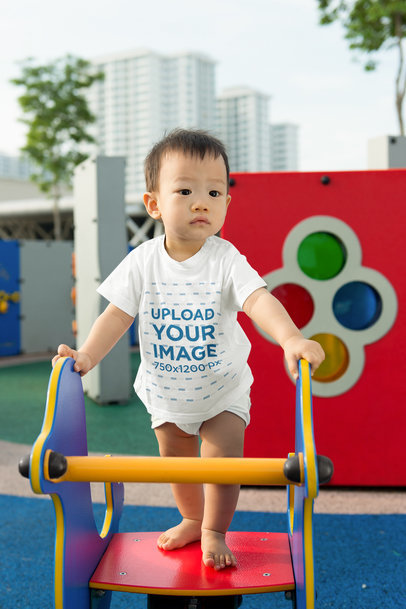 T-Shirt Mockup of a Cute Baby Boy Playing in a Playground m13703 r-el2