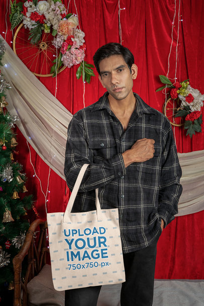 Mockup of a Man Carrying a Tote Bag in a Christmas-Decorated Setting