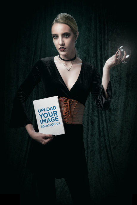 Wicca-Themed Mockup of a Woman Posing With a Book and a Crystal Ball