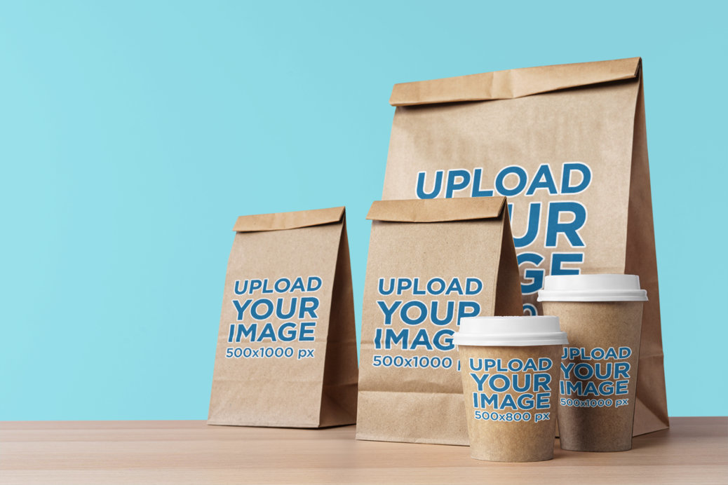 Placeit - Mockup of Three Food Paper Bags and Two Paper Cups Placed on ...