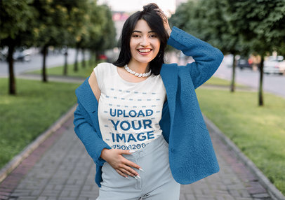 Round-Neck T-Shirt Mockup Featuring a Happy Woman With White Nail Polish