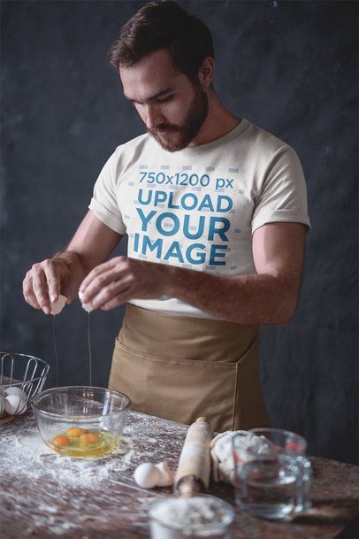 Baker Wearing a Tshirt Mockup Breaking Eggs