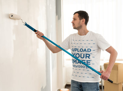 Round-Neck Tee Mockup of a Man Painting a Wall