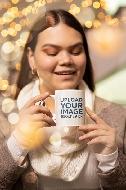 Xmas-Themed Mockup of a Woman in Winterwear Holding an 11 oz Coffee Mug