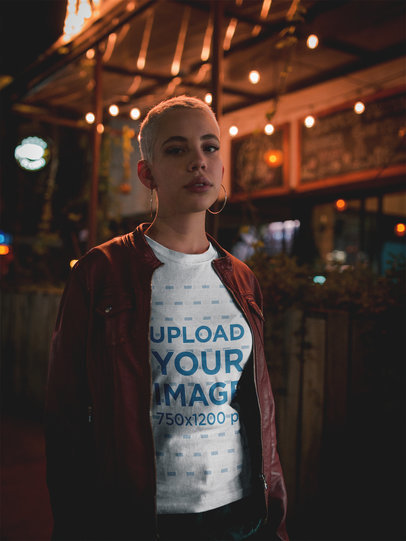 Mockup of a Short Haired Woman Wearing a T-Shirt Outside a Bar at Night