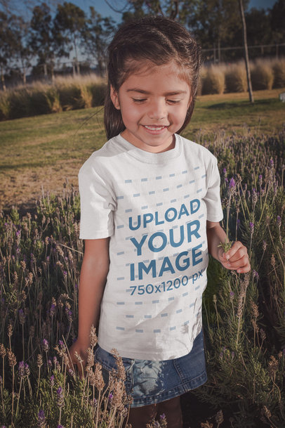 Little Girl Wearing a Tshirt Mockup with Lavender Flowers