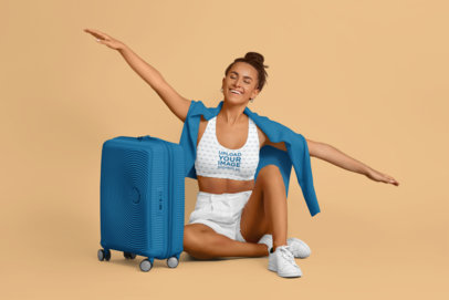 Sports Bra Mockup Featuring a Smiling Woman With a Suitcase