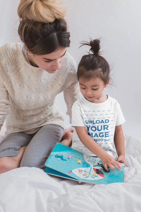 Mockup of a Girl Wearing a T-Shirt Reading with her Mom