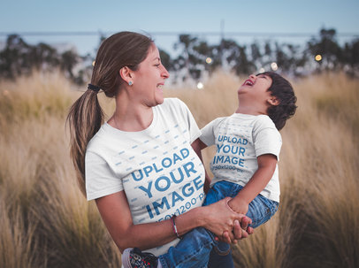 Mom and Son Wearing T-Shirts Mockup Outdoors while Having Fun