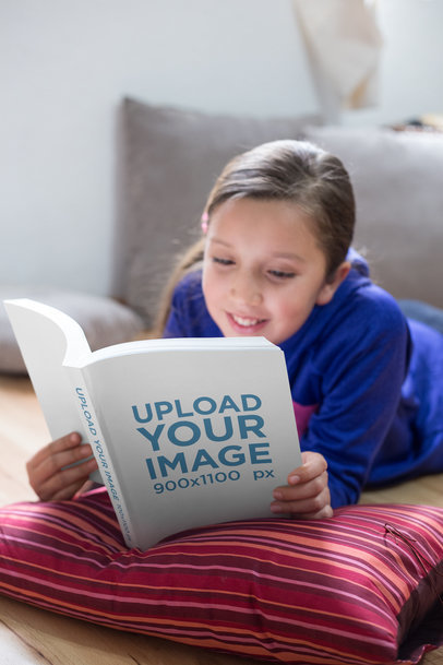Mockup of a Happy Girl Reading a Book While on the Floor