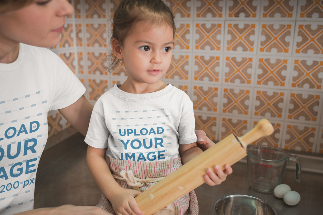 Girl Learning how to Cook Wearing a T-Shirt Mockup with her Mom