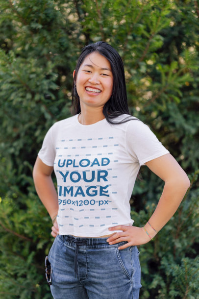 T-Shirt Mockup of a Happy Woman Posing With Her Hands on Her Waist