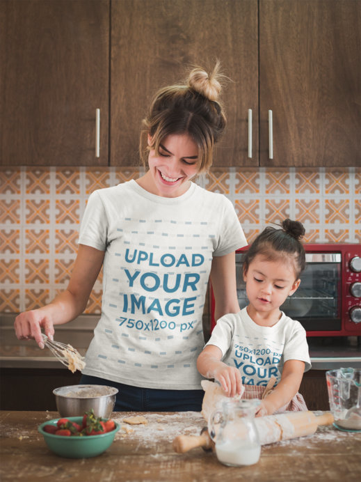 Happy Woman Cooking with her Daughter Wearing T-Shirts Mockup