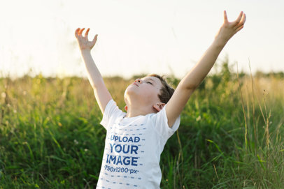 Round-Neck Tee Mockup of a Little Boy Praying in a Field m30625 r-el2