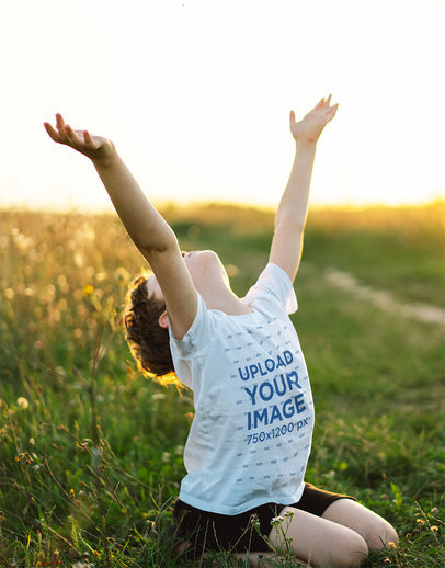 Round-Neck T-Shirt Mockup Featuring a Christian Boy Praying at the Sky m30624 r-el2