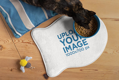 Mockup of a Pet Food Mat Featuring a Cat Eating m30135