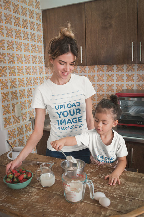 Woman and Daughter Wearing T-Shirts Mockup Baking in the Kitchen