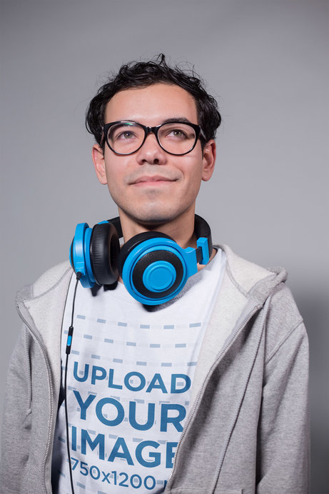 Placeit - Dreamy Geek Dude Wearing a T-Shirt Mockup in a White Room