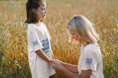 T-Shirt and Sleeve Mockup Featuring a Girl and a Woman Praying in a Wheat Field m30602 r-el2