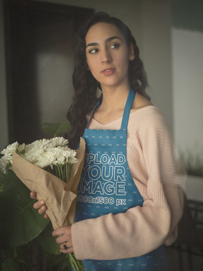 Mockup of a Woman Wearing an Apron Holding Flowers Looking Through a Window