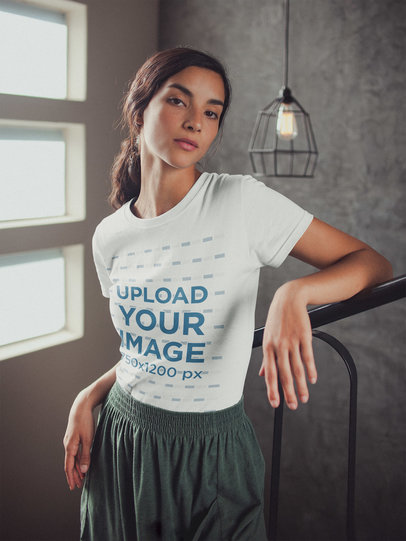 Woman Wearing a T-Shirt Mockup Leaning on a Handrail