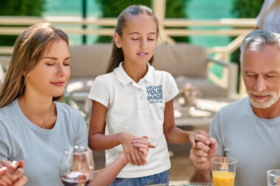 Polo Shirt Mockup Featuring a Girl Praying With Her Family m30591 r-el2