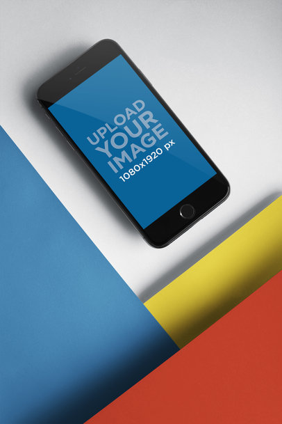 Space Gray iPhone 8 Mockup Lying on a Multicolor Surface