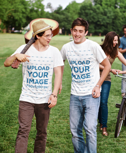 T-Shirt Mockup Featuring Two Friends Walking Happily With a Guitar