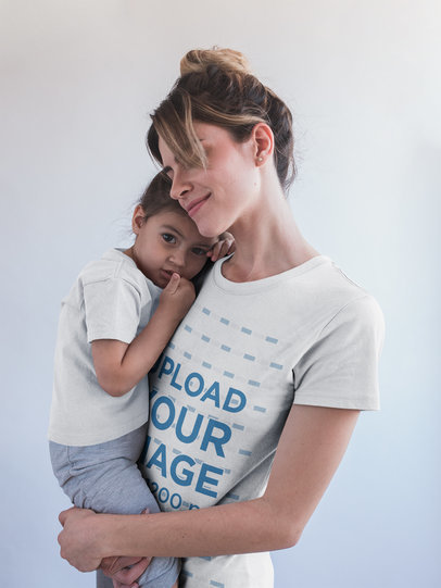 Mom Wearing a T-Shirt Mockup Lifting her Daughter