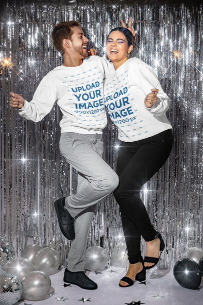 Sweatshirt Mockup of Two Friends Ringing in the New Year with Sparklers