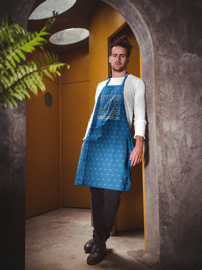 Portrait of a Man Wearing an Apron Mockup Leaning Against a Wall a19880