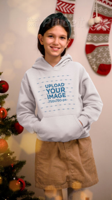 Pullover Hoodie Video Featuring a Smiling Girl in a Christmas-Themed Setting