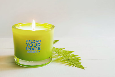 Mockup of a Scented Candle Placed Next to a Leaf m30422 r-el2