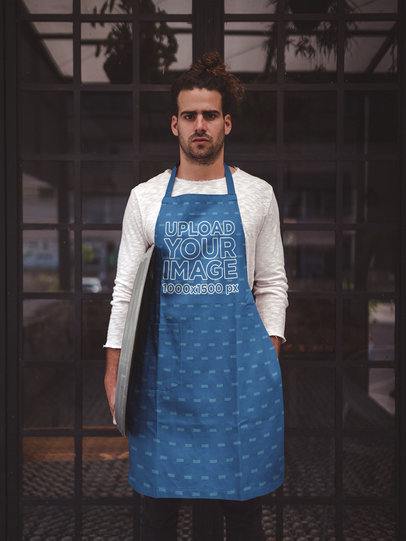 Bar Tender Wearing an Apron Mockup Standing Against the Restaurant's Door a19886