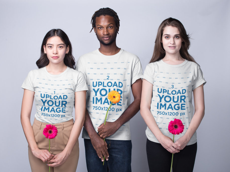 Mockup of Three Interracial Teens Wearing Shirts Mockup Holding Flowers